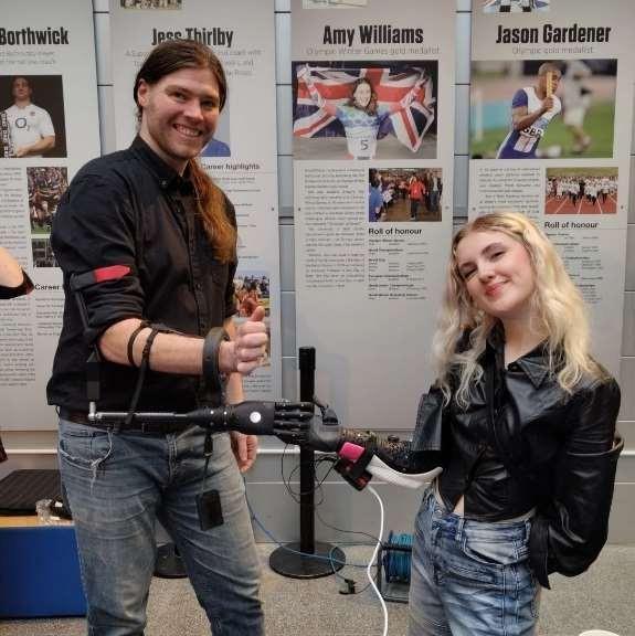 Chris demonstrating assistive technology to the UK Chief Scientific Officer, alongside bionic-limb advocate Tilly Lockey